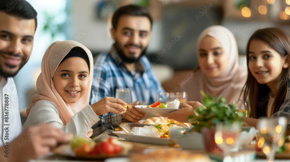 Muslim family gathering around dining table for Ramadan dinner. Muslim family gathering around dining table for Ramadan dinner.