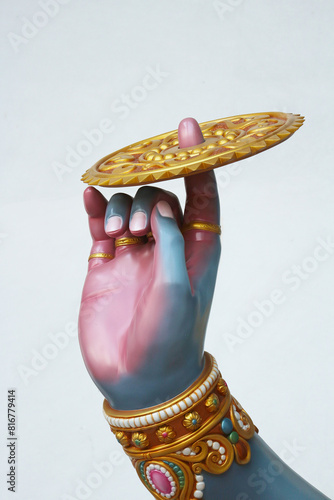 The legendary weapon of Vishnu is the Sudarshana Chakra on the finger.
