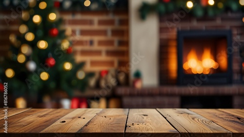 Wood table with blurry christmas tree and fireplace background