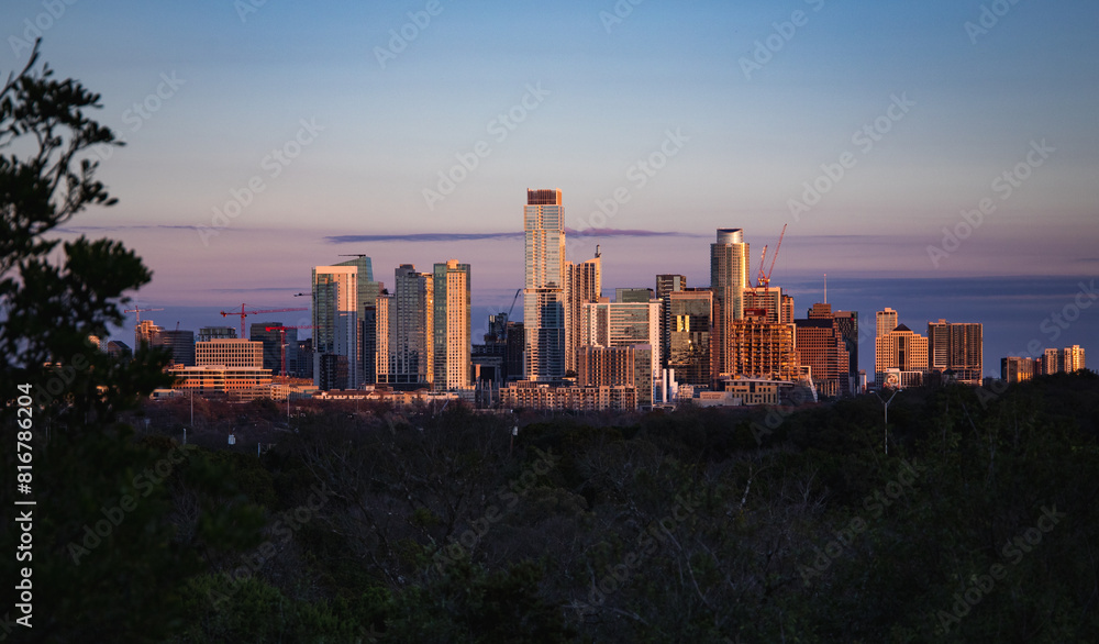 Aerial view of the beautiful skyline of Downtown Austin, Texas illuminated by the golden sunset Aerial view of the beautiful skyline of Downtown Austin, Texas illuminated by the golden sunset