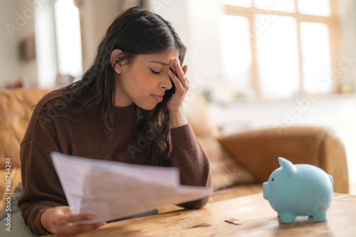 Slika na platnu disappointed young indian woman reading letter savings employment tax paying ene