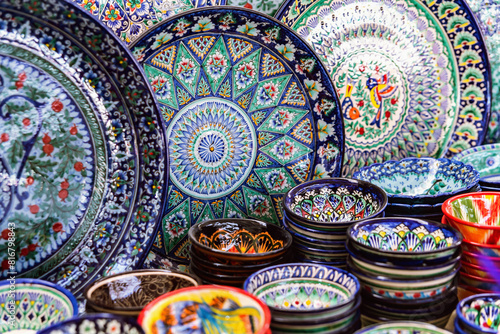 Vibrant collection of Samarkand souvenir ceramics  featuring beautifully handcrafted plates and bowls with intricate patterns in bold colors. Samarkand  Uzbekistan