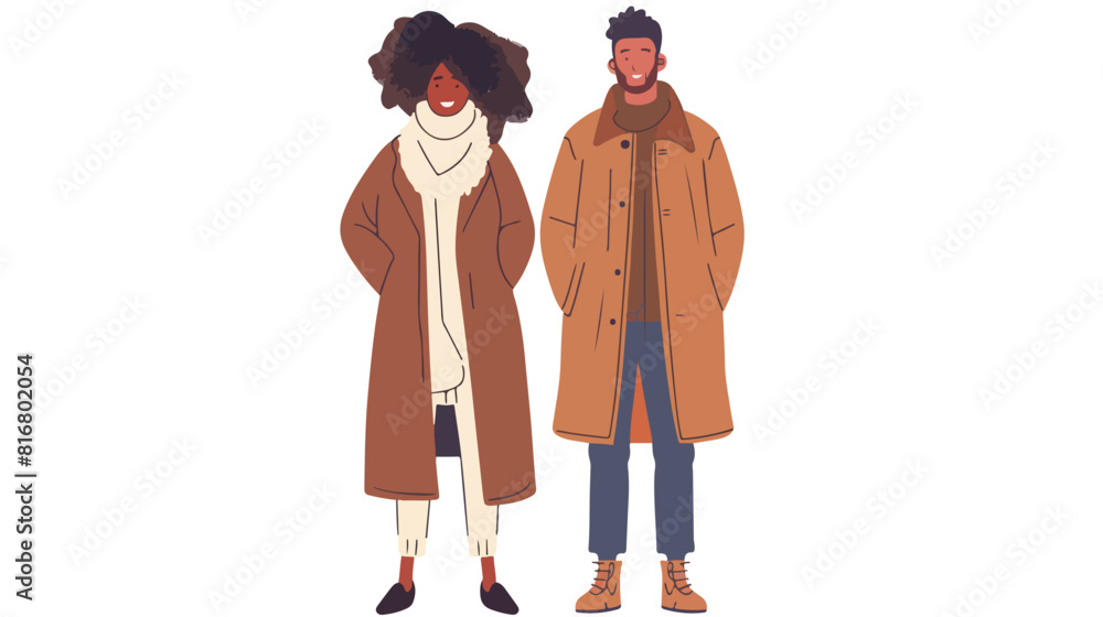 Smiling man and woman dressed in coats standing together