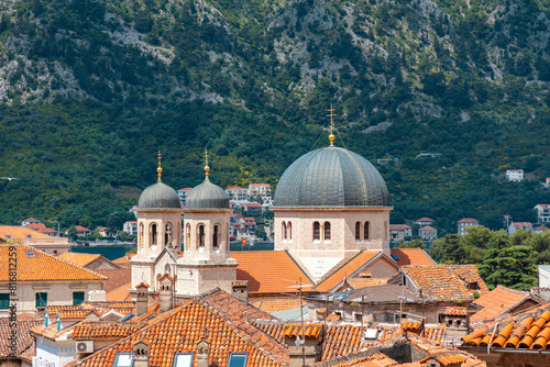View of the Mediterranean old town and Dome of St. Nicholas Church towering over the red tiled roofs. Cityscape of Kotor, Montenegro