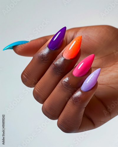 AI generated photo of a black woman's hand with bright multicolored manicure on long stiletto nails. Isolated on white background photo