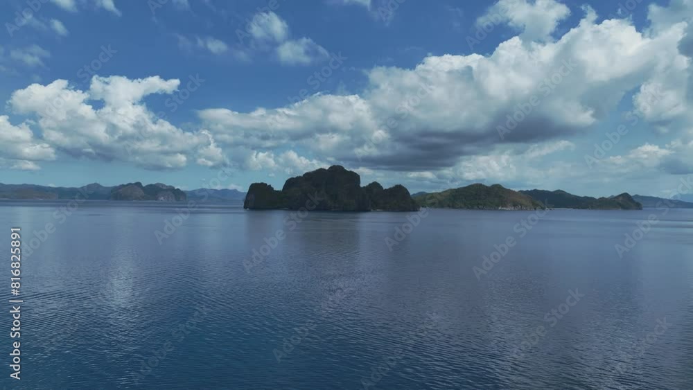 The Aerial view of white sand beach bathed by a crystal clear water. Entalula island, Bacuit Bay, El Nido, Palawan, Philippines. The Aerial view of white sand beach bathed by a crystal clear water. Entalula island, Bacuit Bay, El Nido, Palawan, Philippines.