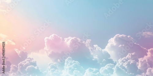 The image is a depiction of a beautiful sky with a gradient of pastel colors and fluffy clouds.