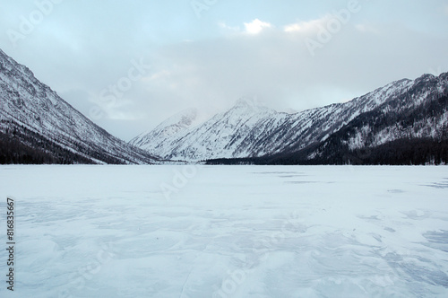 Snow-covered winter mountain lake, Russia, Siberia, Altai mountains.