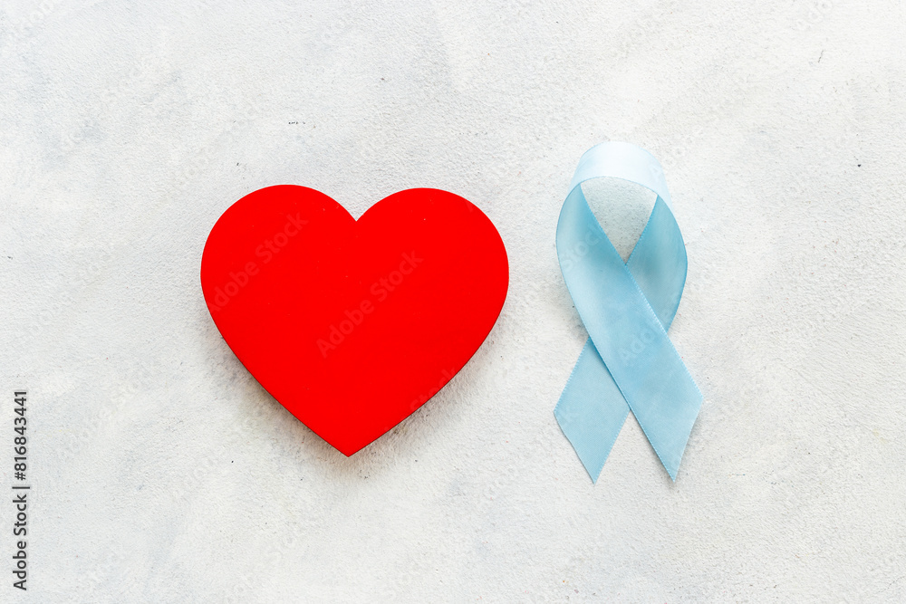 Blue ribbon with heart for world colon cancer day