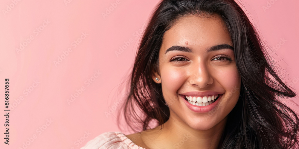 Young beautiful indian woman smiling on pink background Young beautiful indian woman smiling on pink background