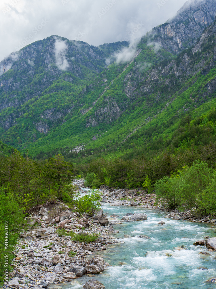 Turquoise Waterfall in Dense Green Vegetation, Theth National Park, Albania