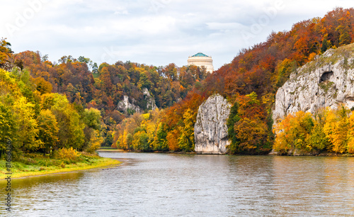 Autumn panorama with colorful foliage Donau river and “Hall of Liberation“ monument in Kelheim, (Germany). The famous “Weltenburger Enge“ narrows or Danube Gorge is natural reserve and touristic site photo