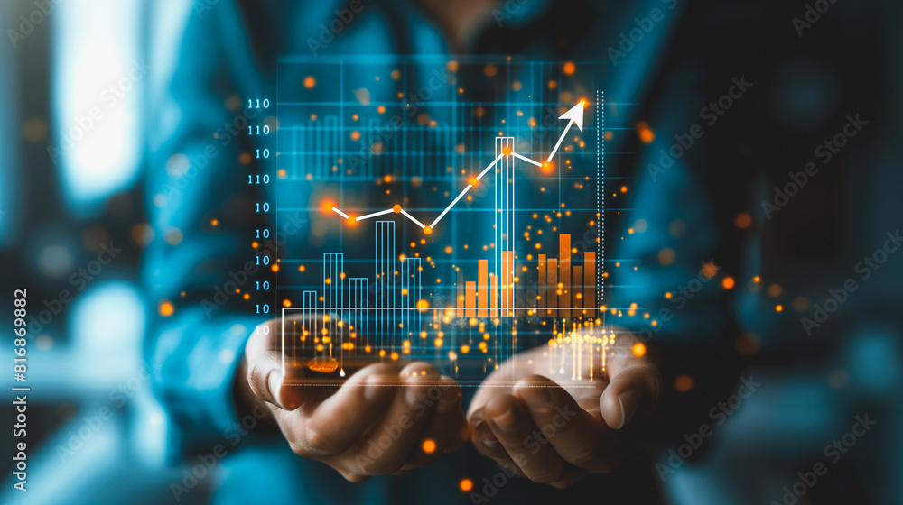 A person is holding a screen that shows a graph with a line going up A person is holding a screen that shows a graph with a line going up