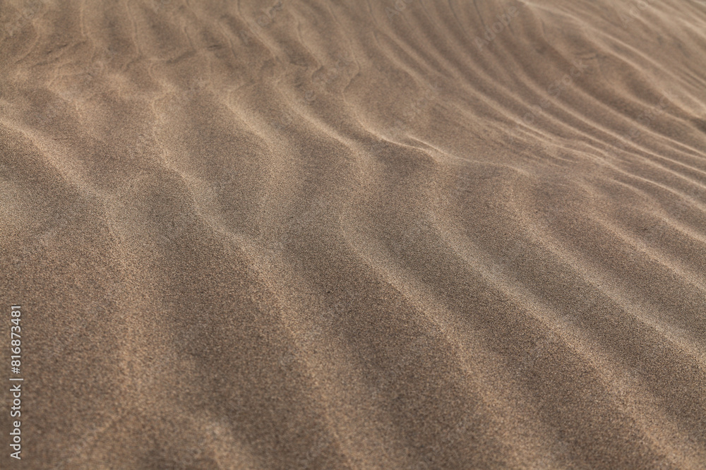 natural sand pattern created by wind blowing differently sized and colored particles natural sand pattern created by wind blowing differently sized and colored particles