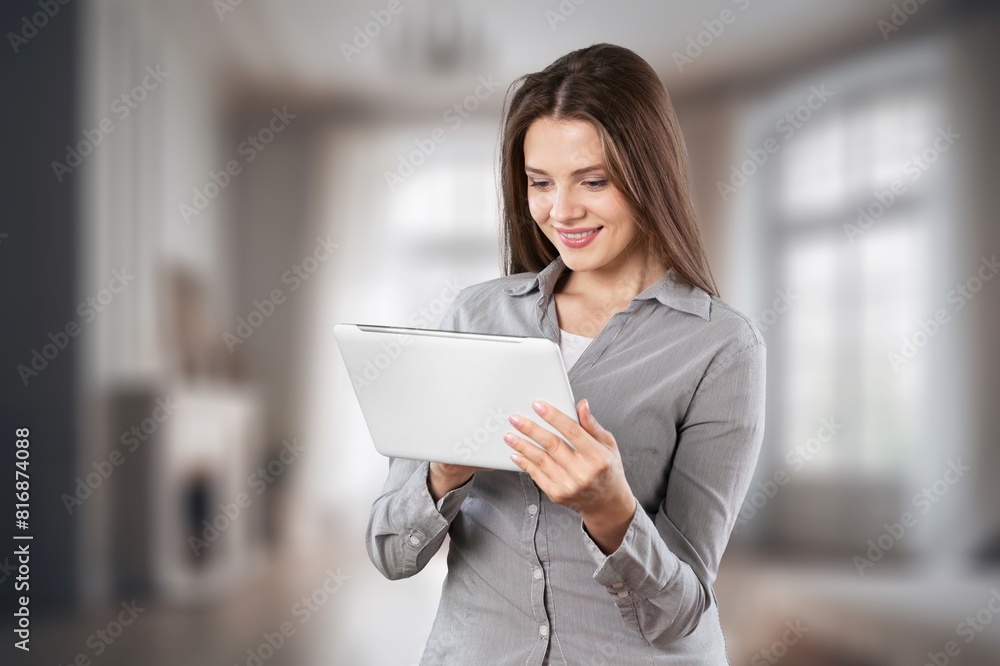 Young happy woman student looking at digital tablet Young happy woman student looking at digital tablet