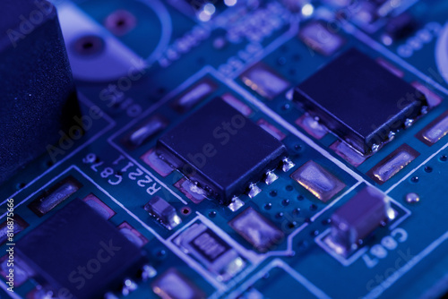 Close-up view of an integrated circuit mounted on a green printed circuit board.