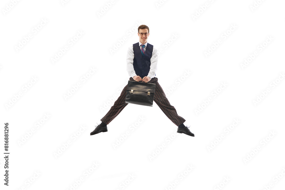 Happy smiling man in formal wear, employee, office worker jumping with briefcase isolated on white background. Getting promotion. Concept of business, office lifestyle, entrepreneurship