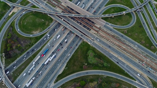 Slika na platnu Highway arteries pulse with vehicles, aerial view exposes vibrant lifeblood of city infrastructure