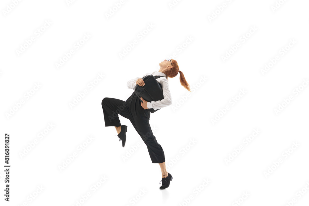 Focused woman in formal wear, manager in motion wit brief case, running to work isolated on white background. Promotion, deadlines. Concept of business, office lifestyle, entrepreneurship