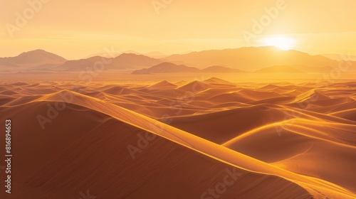 Desert sunset with golden dunes and blue sky