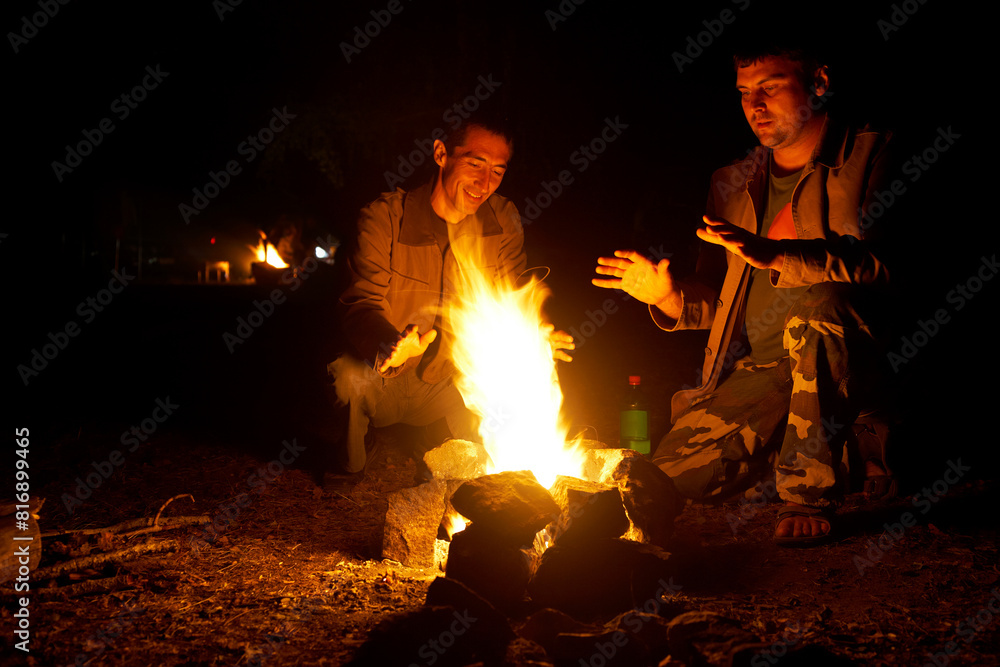 by the fire outdoors