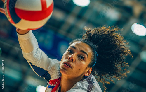 Female volleyball player while receives the ball diving