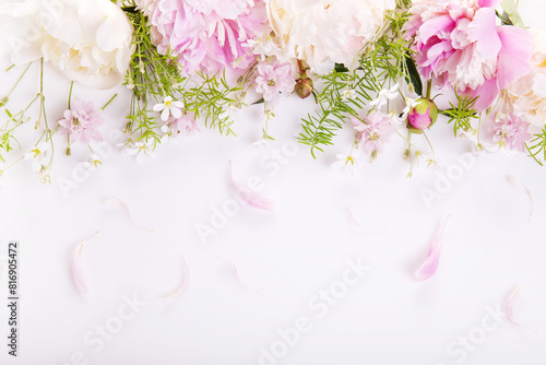 Wedding invitation or Mother's Day background, empty space with pink peony flowers, top view flat lay.