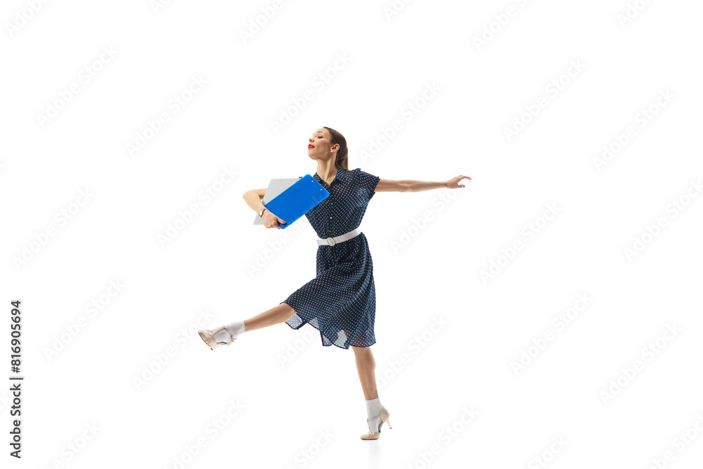 Fototapeta premium Motivated and ambitious woman, office worker in motion, walking with documents, folders isolated on white background. Concept of business, office lifestyle, entrepreneurship