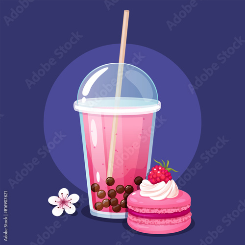 Cold raspberry bubble tea in takeaway plastic cup with yummy French macaron.
