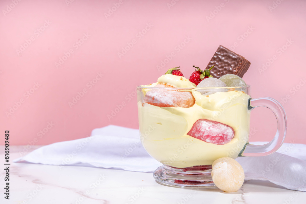 Mochi parfait trendy asian dessert, ice cream parfait layered with fruit, berry, sweets and various mochi. Summer frozen sweet snack in portioned cup, copy space Mochi parfait trendy asian dessert, ice cream parfait layered with fruit, berry, sweets and various mochi. Summer frozen sweet snack in portioned cup, copy space