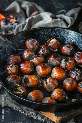 Cast iron pan filled with aromatic roasted chestnuts, evoking seasonal comfort and traditions photo