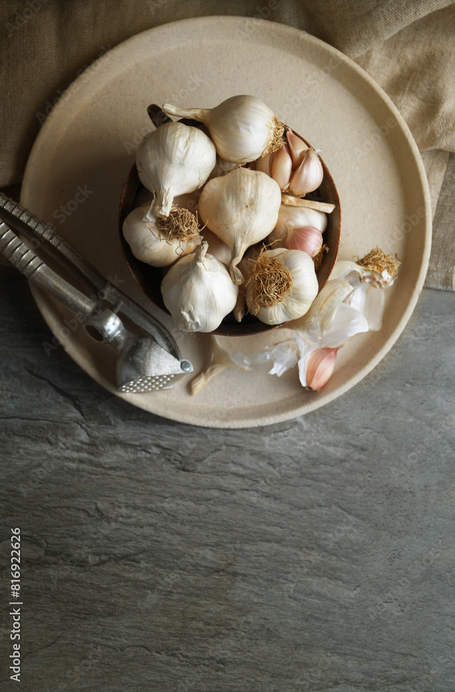 Close-up of garlic and seashells on table Close-up of garlic and seashells on table