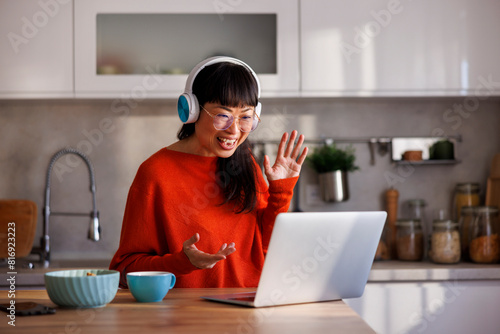 Woman having online meeting while working from home
