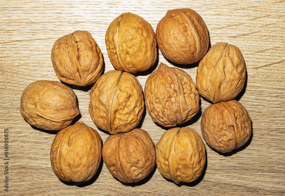 a bunch of walnuts on the table surface a bunch of walnuts on the table surface