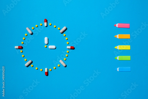 Clock made from colorful pills as a concept of taking medicine in time, by prescription.