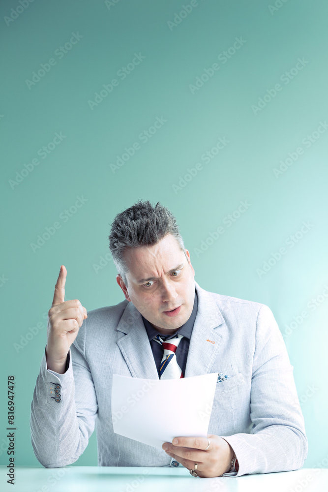 Anchorman points up, alarmed, reading shocking news Anchorman points up, alarmed, reading shocking news