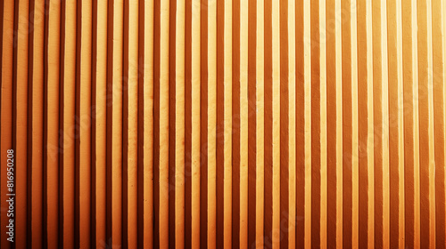 Close-up of a textured, vertical striped wall with an earthy orange hue creating a modern and industrial look.