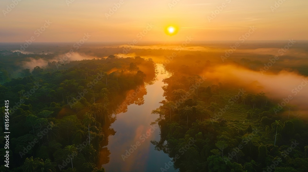 Obraz premium Sunrise over the Amazon forest, aerial shot capturing the gentle mist and the first light at the horizon, showcasing nature's beauty
