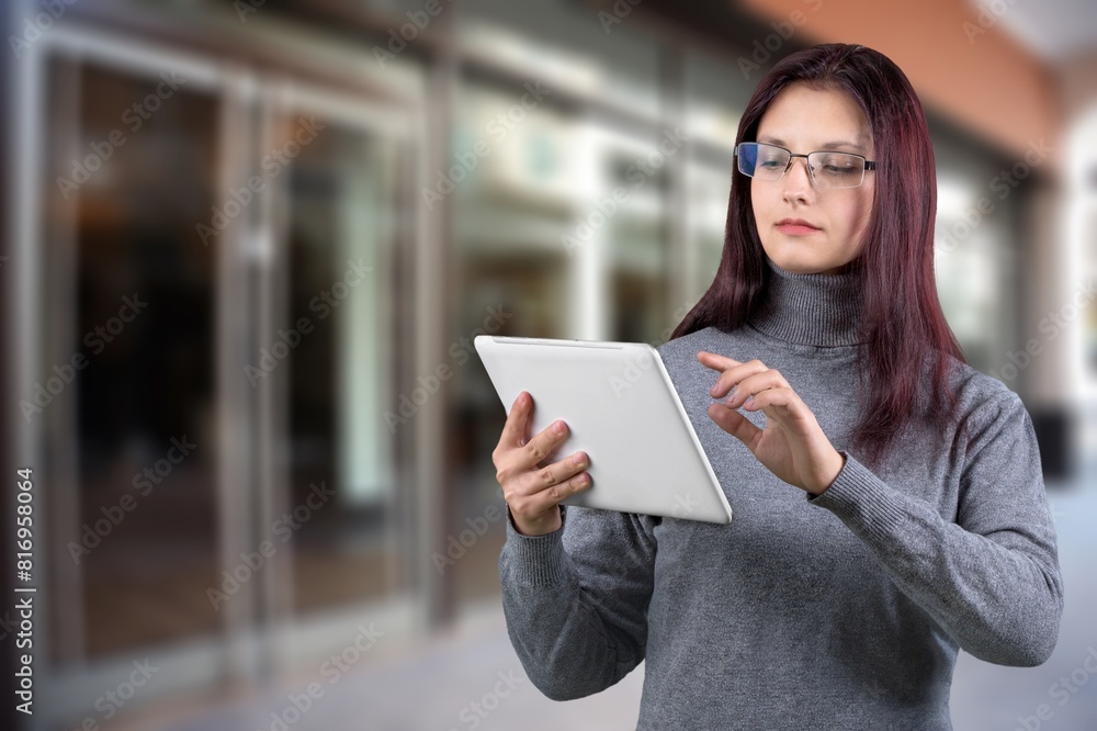 Smiling busy business manager hold tablet computer Smiling busy business manager hold tablet computer