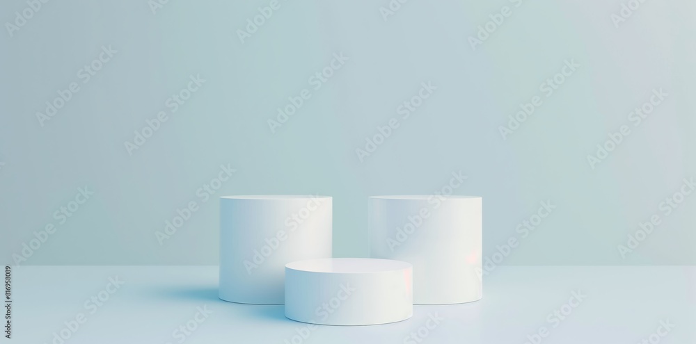 Abstract white background with three cylinder pedestal podiums for product presentation on light blue background Abstract white background with three cylinder pedestal podiums for product presentation on light blue background