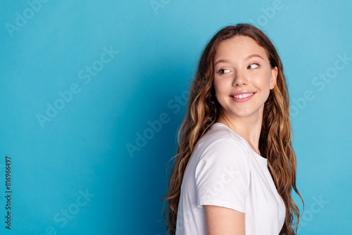 Photo of lovely cute dreamy girl wear white trendy pajama look empty space isolated on blue color background © deagreez