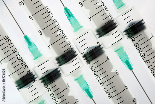 Hypodermic syringes on a white background photo