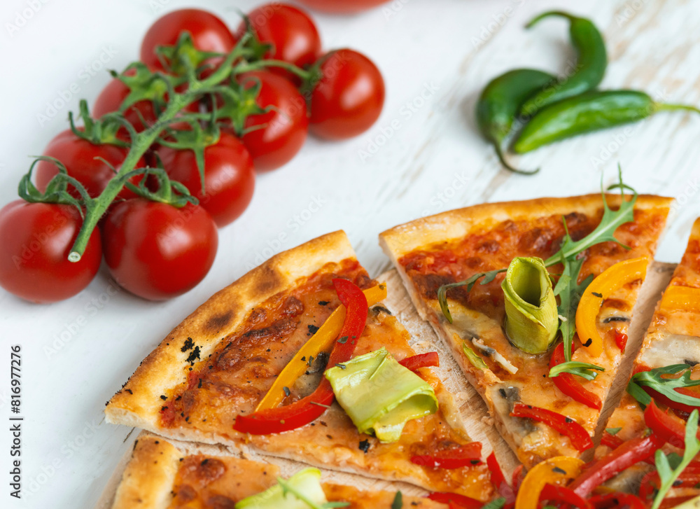 vegetarian pizza with cheese, tomato, pepper and avocado in white wooden desk.Top view vegetarian pizza with cheese, tomato, pepper and avocado in white wooden desk.Top view