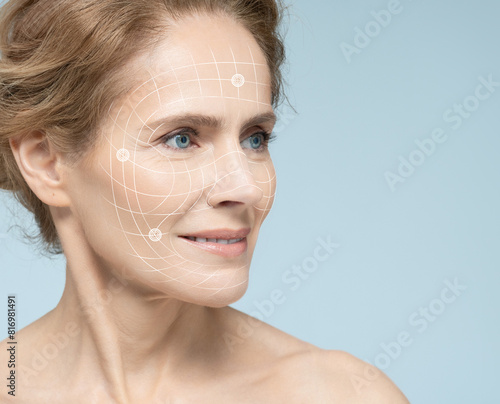 Mature female face with lifting lines showing skin lifting and facial contouring during cosmetic and beauty procedures. Facial rejuvenation concept