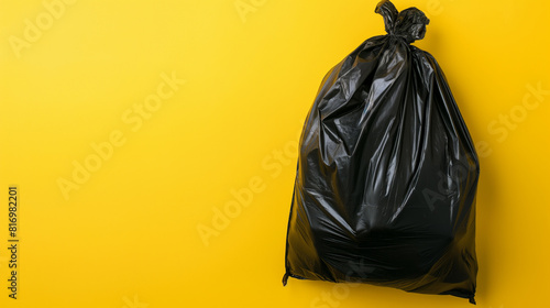 Close up, saco de lixo em fundo amarelo isolado. photo