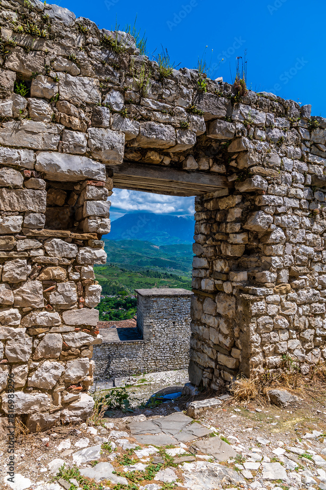 A view through a doorway in the castle above the city of Berat, Albania in summertime A view through a doorway in the castle above the city of Berat, Albania in summertime