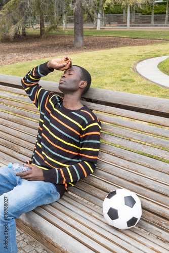 Young man experiencing hypoglycemia after soccer session