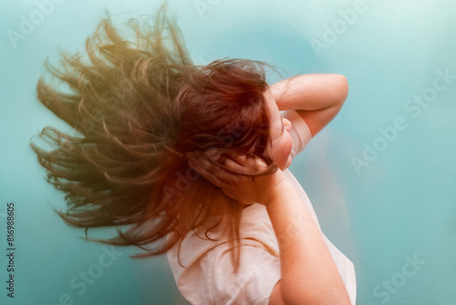 Woman struggling with dizziness, concept of hypoglycemia photo