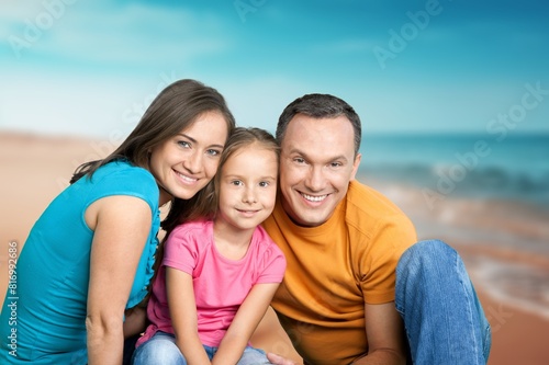 Happy family with children having fun on the beach