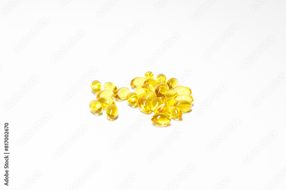 capsules with yellow gelatin, vitamins, nutritional supplements on a white background capsules with yellow gelatin, vitamins, nutritional supplements on a white background